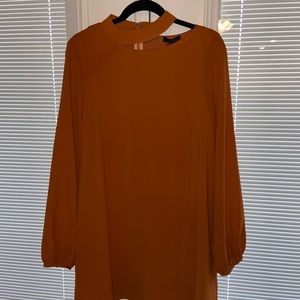 NWT extremely flattering swing dress with long sleeve and neck cutout detail.